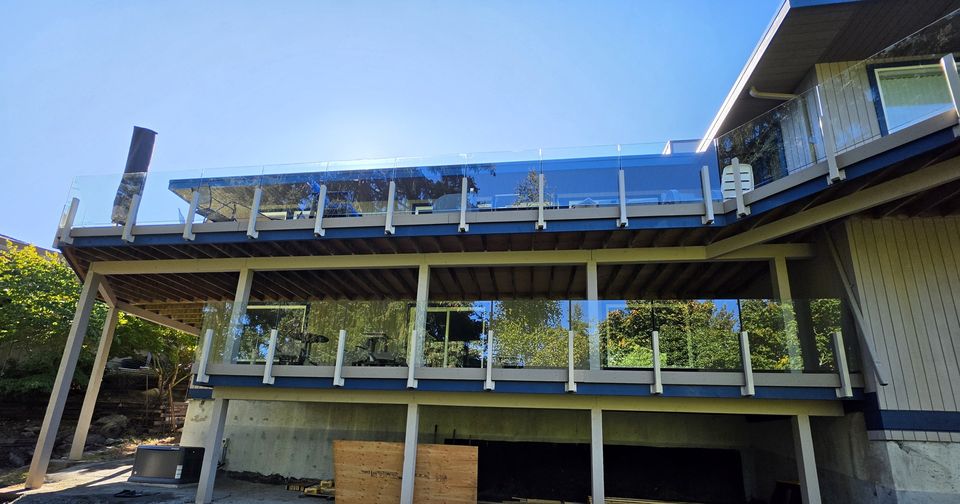 Glass deck railings, two levels, Mid-Island · September 2026