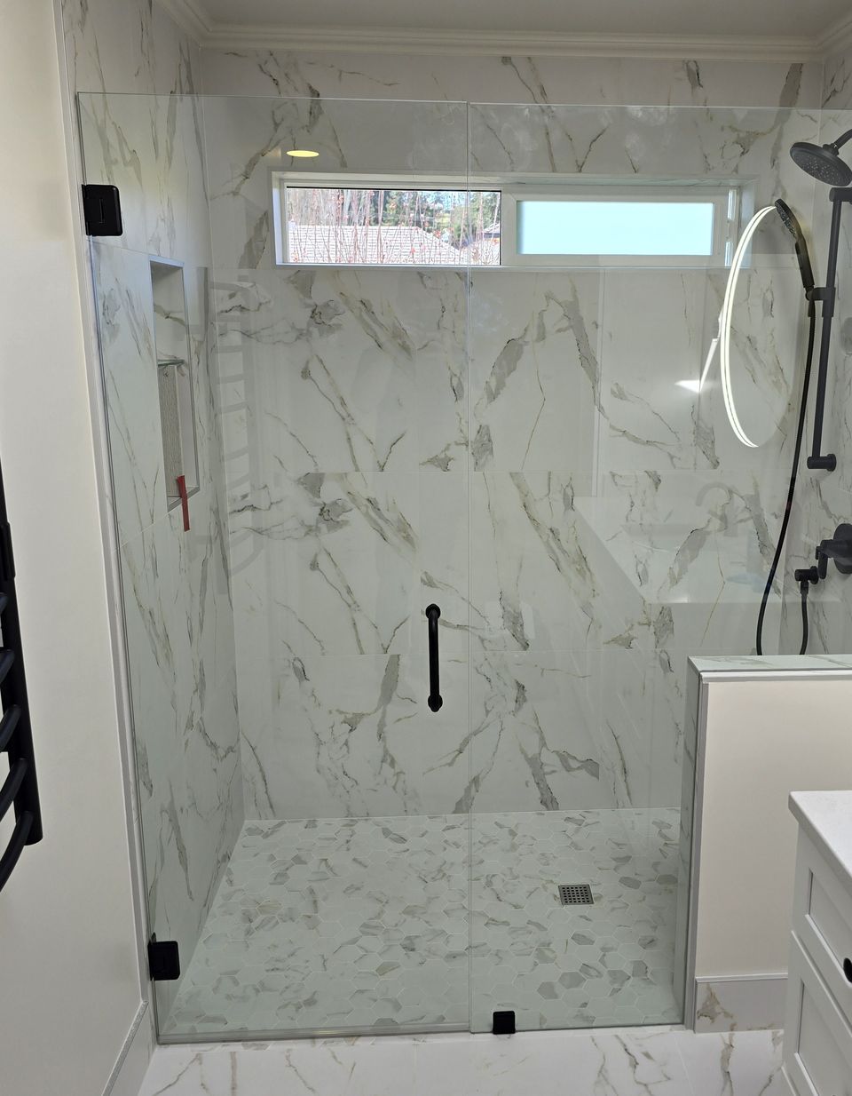 Glass door and panel, marble tile, Mid-Island · April 2025
